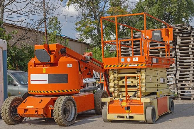 forklift in action at busy industrial warehouse in Needham